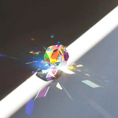 the sun shines brightly on an object that appears to be multicolored crystals