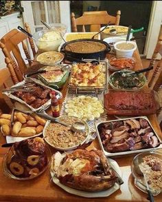 a wooden table topped with lots of food