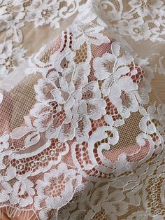 an image of lace fabric with flowers on it