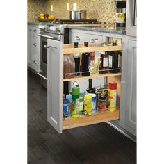 an open cabinet in the middle of a kitchen with lots of spices and condiments