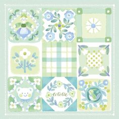 a blue and green patchwork quilt with flowers