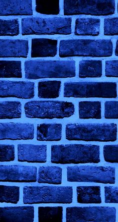 a blue brick wall that is very dark