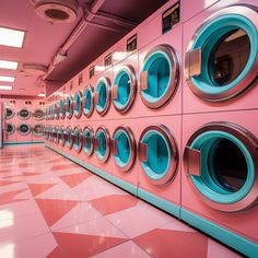 a row of washers sitting next to each other on a tiled floor in front of a pink wall