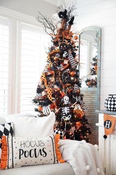 a decorated halloween tree in a living room