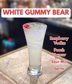 a white gummy bear drink sitting on top of a counter