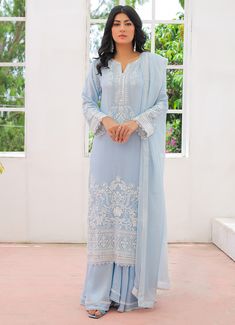 This beautiful light blue chiffon  straight cut suit comes with round with a  V neckline with all over white thread + sippi embroidery. It comes paired with  viscose sharara with laces on its hemline and beautiful chiffon dupatta . Light Blue Suit Women Outfit, Blue Salwar Suit, Chiffon Kurti, Green Sharara, Indian Clothing Brands, Traditional Women, Light Blue Suit, Ethnic Wear Indian, Sharara Suits