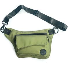 a green fanny bag with a black strap