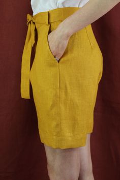 "Women linen shorts with 2 pockets in mustard color, perfect for casual wear and suitable for any occasion in any season Details: - 100% natural linen produced in Europe ; - medium weight (180 gram per square meter); - color: mustard, can be any from our colors catalogue (color samples at the photo); Made to order, approximately a few days, If you have any questions please message me and I will be glad to answer. Size guide : Size XS Bust: fits bust around 33\"-34\"/ 84-88 cm Waist: fits waist a Spring Linen Shorts With Side Pockets, Linen Shorts With Side Pockets For Spring, Knee-length Shorts With Side Pockets For Summer, Yellow Bermuda Shorts For Summer, Linen Shorts With Side Pockets, Fitted Linen Summer Shorts, Summer Linen Shorts With Side Pockets, Linen Bermuda Shorts With Side Pockets, Casual Knee-length Linen Shorts