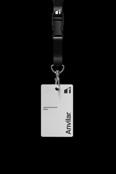 a black and white photo of a lanyard with a name tag attached to it