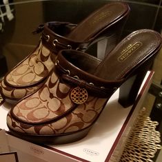 Signature Coach "Jody" Mule Heels With Classic Canvas Coach Logo With Gold Accent And Leather Trim. Only Worn A Few Times. Comes With Original Box. Small Scuff On Leather On Right Shoe. Shoe Polish Can Cover. In Very Good Condition. Mule Heels, Shoe Polish, Coach Logo, Gold Accent, Coach Shoes, Mule Clogs, Mules Shoes, Leather Trim, Tan Brown