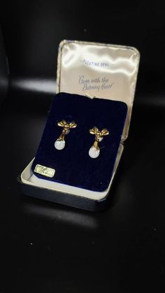 Beautiful Rare vintage Bow style floating opal earrings. Earrings are gold filled(stamps). Earrings are screwball. Original vintage case included! 100percent Genuine opal Any questions or concerns please let us know. Australian Opal Pendant, Opal Earrings, Australian Opal, Opal Pendants, Opal Necklace, Screw Back Earrings, Gold Filled, Floating, Opal