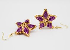 Folded celtic boho 3D star earrings are made of metallic purple and gold tiny miyuki delica beads. They are japanese original miyuki beads and all are AAA quality. Gold beads are 24 carat gold plated beads. Miyuki earrings are also wonderful gifts for mom, wife, girlfriend and sister for their birthdays and for their special days. Miyuki beads are all same sizes. So gorgeous designs can be made with these delica beads. If you need to customize your order please contact me. If you avoid your earr Miyuki Earrings Stand, Silver Star-shaped Beaded Earrings, Sailor Moon Beaded Earrings, Star-shaped Beaded Earrings As Gift, Miyuki Star Pattern, Star Brick Stitch Pattern, Purple Star-shaped Beaded Jewelry, Miyuki Earrings, Dangle Beaded Earrings