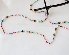 more sunglasses chain in DearDanielleJewelry: https://www.etsy.com/shop/DearDanielleJewelry?ref=seller-platform-mcnav&section_id=28433527 Multi beads and rhinestone sunglasses chain. ethnic beads necklace. bohemian sunglasses chain **framed gems, and charms in the jewelry is plated. *All the jewelry in my shop will be sent in cotton pouch. If you want gift box wrapping, please let us know we will send your jewelry in gift box. Cheap Multicolor Adjustable Glasses Chains, Bohemian Sunglasses, Beads Sunglasses, Rhinestone Glasses, Glasses Mask, Beaded Glasses Chain, Beaded Glasses, Gift Box Wrapping, Beaded Sunglasses