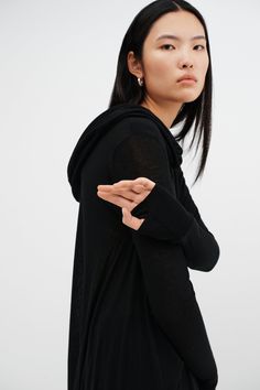 Meet our Oslo Tunic, the definition of elevated loungewear. Fashioned from soft and high-stretch sheer European jersey, she offers comfort that you can live in for days on end. Oslo updates the tunic silhouette with stunning details, such as an oversized hood and a draped, high-low hem that dips at the back. Her dropped shoulders extend to relaxed long sleeves, complete with thumbholes for a cozy, finishing touch. Shop also her best-selling sister hoodie, Firenze, crafted from our European Frenc Hooded Tunic, Fringed Belt, Fringe Skirt, Floral Shoes, Black Tunic, Scarf Men, Mens Scarves, Suit Accessories, High Low Hem