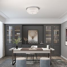 an office with gray walls and wooden floors