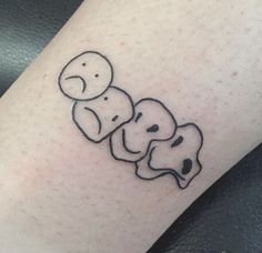 a couple of elephants sitting next to each other on top of a person's leg