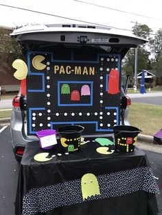 the back end of a car with pac - man decorations on it's trunk