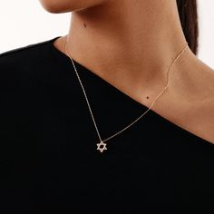 "This diamond star of david necklace in 14k solid gold is the perfect way to express your beliefs your style. The gold star of david pendant, with its beautiful dainty design, showcases your love for your faith and heritage in a subtle way.  F E A T U R E S  * Diamond Quality: Diamond carat: 0.08 ct. Clarity: VS2 Color: F-G Cut: Excellent cut Diamond type: Natural Diamond Setting Type: Prong Setting  * Gold Carat: 14K  * Choice of Gold Color: Yellow Gold, Rose Gold, White Gold  * Pendant Height: Minimalist 14k Gold Star Of David Necklace, Minimalist Yellow Gold Star Of David Necklace, Gold Star Pendant, Star Of David Necklace, Star Of David Pendant, Star Pendant Necklace, Diamond Star, Affordable Jewelry, Star Of David