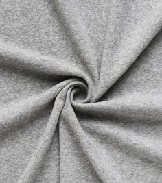 a grey fabric with a circular design on it