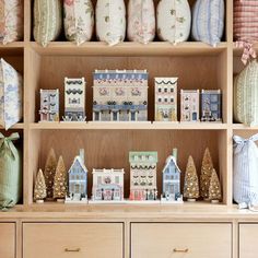 a wooden shelf filled with lots of christmas decorations