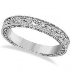 a wedding band with intricate engraving on it