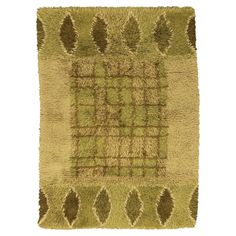 a rug with green and brown designs on it