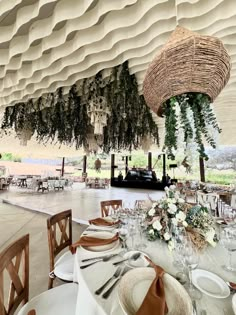 an outdoor dining area with tables and chairs set up for a formal function at the resort