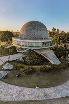 an aerial view of a building with a large dome on the top and stairs leading up to it