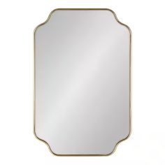 a gold framed mirror on a white wall