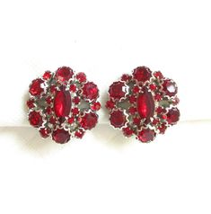 Deep Rich Red Rhinestone and Silver Decorative Prong Mount Vintage Clip Back Earrings - NY Estate Jewely Retro Red Clip-on Earrings For Formal Occasions, Vintage Red Clip-on Earrings For Anniversary, Red Vintage Clip-on Earrings For Anniversary, Retro Red Earrings For Formal Occasion, Red Retro Earrings For Formal Occasions, Retro Red Formal Earrings, Red Formal Costume Jewelry Earrings, Red Costume Jewelry Earrings For Formal Occasions, Vintage Red Clip-on Earrings For Evening