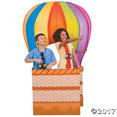 two children are in a hot air balloon