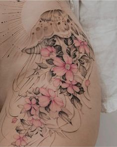 a woman's stomach with pink flowers on it