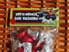 there is a bag of valentine's candies in the shape of monster trucks