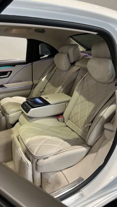 the interior of a car with an electronic device in it's center console area