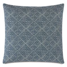 a blue and white pillow on a white background