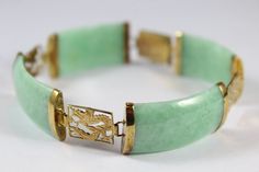 -Vintage Chinese 14k Gold Dragon with Jade Bracelet -Total length:about 7.5 in -Gold dragon size: 12.5 mm x 10 mm -Jade size: 1.1 in x 0.6 in -Total weight: 21.8 in -Marked 14k & GST -Have a safety lock Art Deco Jade Jewelry For Formal Occasions, Formal Art Deco Jade Jewelry, Green Art Deco Bracelets For Formal Occasions, Art Deco Green Bracelet For Formal Occasions, Art Deco Green Bracelets For Formal Occasions, Classic Jade Bracelets For Formal Occasions, Green Rectangular Bracelet For Formal Occasions, Green Rectangular Bracelets For Formal Occasions, Luxury Jade Bracelets For Formal Occasions