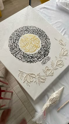 an intricately decorated box sits on a table