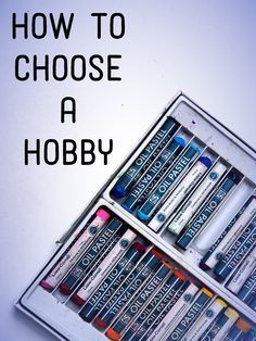 an open box filled with crayons on top of a blue tablecloth that says, how to choose a hobby