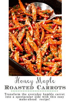 honey maple roasted carrots with pomegranate and herbs in a baking pan