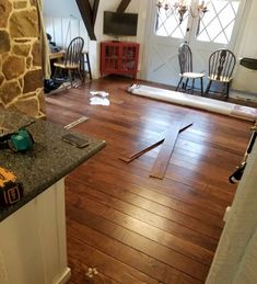 a room with hard wood floors and tools on the floor