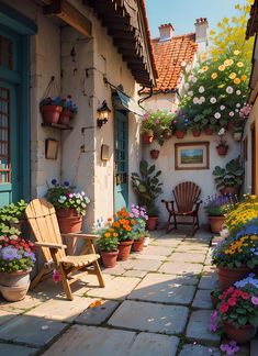 an outdoor patio with potted plants and flowers on either side of the house door