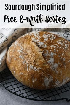 a loaf of sourdough sitting on top of a cooling rack with the words free e - mail series