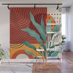 an orange and green wall mural in a living room