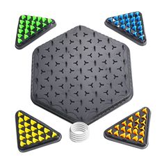 four different colors and shapes of an object with black, green, yellow, and blue triangles