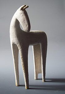 a white sculpture sitting on top of a table