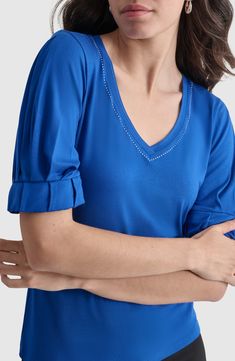 Pleats at the sleeves and silvery studs at the neckline add eye-catching details to this stretchy jersey top. V-neck Elbow-length sleeves 95% rayon, 5% spandex Machine wash, dry flat Imported Blue V-neck Elastane Top, Pleat Sleeve, Pleated Sleeves, Lapis Blue, Elbow Length Sleeve, Jersey Top, Top Brands, Nordstrom, Spandex