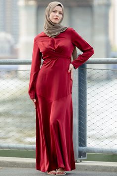 The perfect dress for that thing you had to go to! The Red Criss Cross Satin Long Sleeve Maxi Dress features a round neckline, criss cross wrap waist , and fit and flare silhouette. The dress is fully lined. This soft and feminine texture and color gives the perfect level of modesty and elegance! Criss cross wrap waist Zip fastening Regular fit True to size Satin  Lined Model is 5'10" wearing a size S Feminine Texture, Hijab Collection, Swimsuits Outfits, Maxi Cardigan, Hijabi Style, Satin Long Sleeve, Urban Dresses, Linen Maxi Dress, Sleeve Maxi Dress