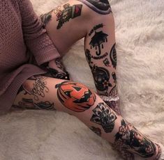 a woman with many tattoos on her legs