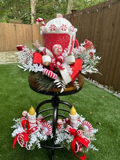 a christmas centerpiece with candy canes, candies and marshmallows