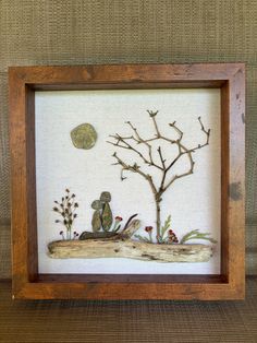 a wooden frame with some artwork on it